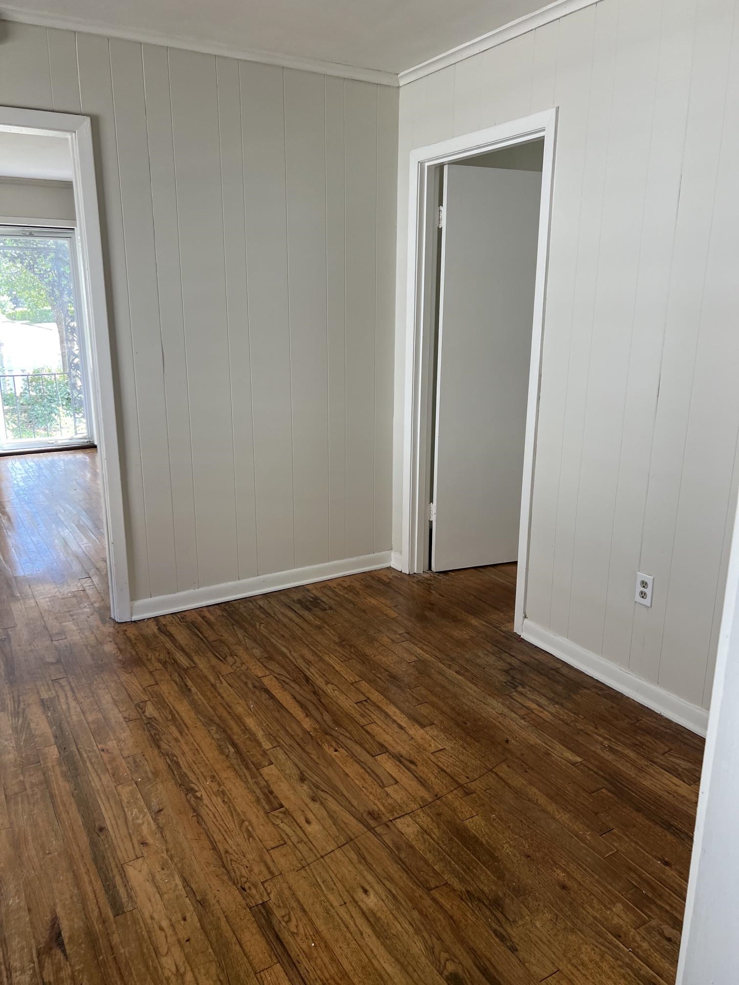 518 Harris Street Collierville, TN 38017 - Photo 5 of 13 Hardwood-look flooring throughout, complemented by vertical paneling on walls