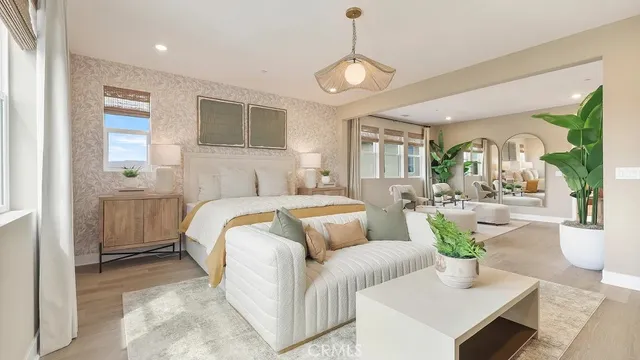 a bed room with furniture and a chandelier