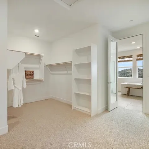 a view of an empty room with a fireplace