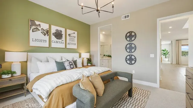 a bedroom with a bed and a wall painting