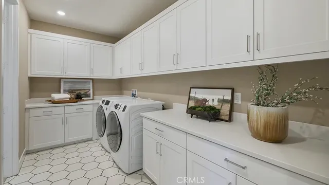 a kitchen with a white stove top oven and white cabinets