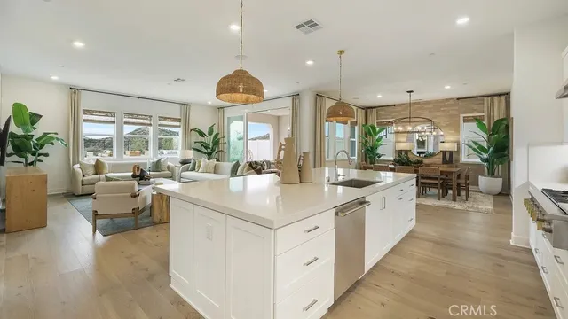 a large kitchen with lots of counter space and windows
