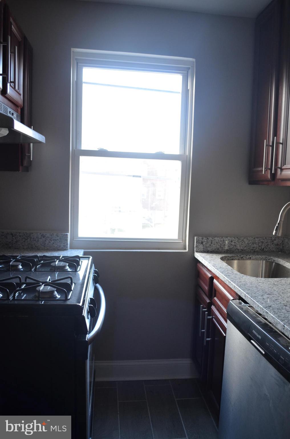 4952 Brookwood Road Baltimore, MD 21225 - Photo 3 of 13 a room with storage and utility