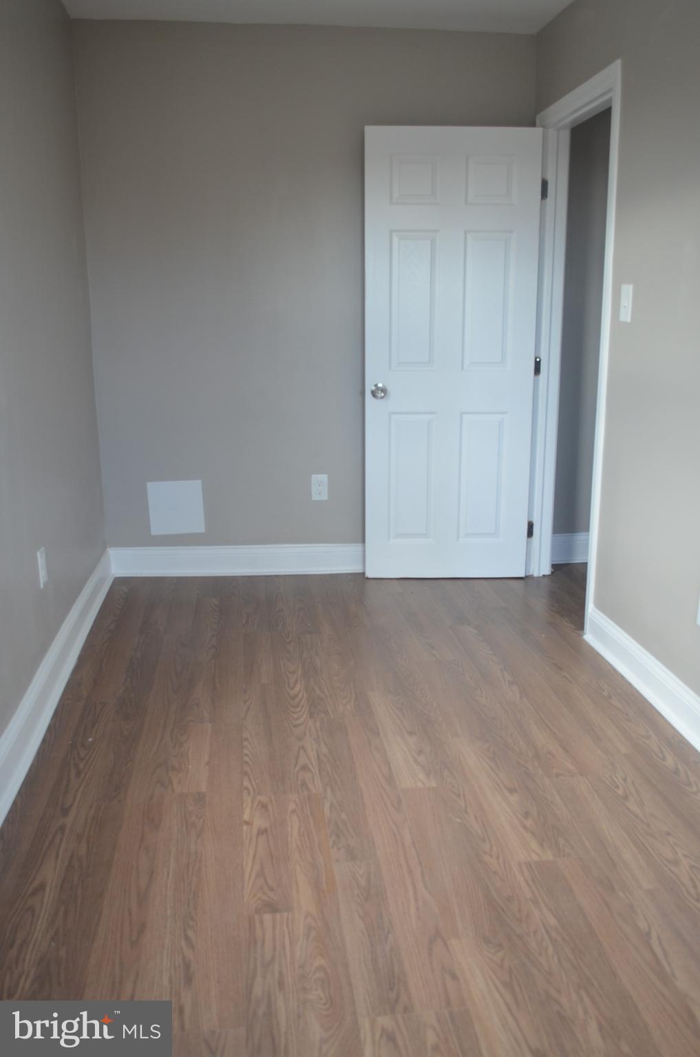 4952 Brookwood Road Baltimore, MD 21225 - Photo 10 of 13 a view of room with hardwood floor