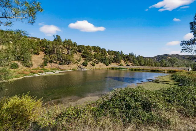 a view of lake with green space