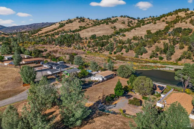 an aerial view of houses with outdoor space