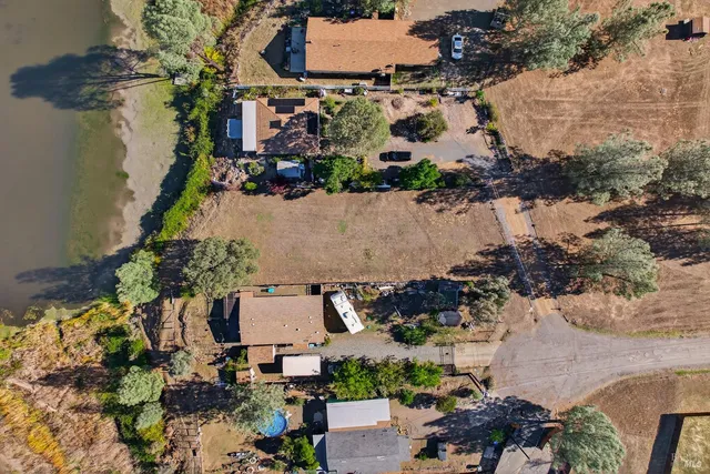 an aerial view of residential houses with outdoor space