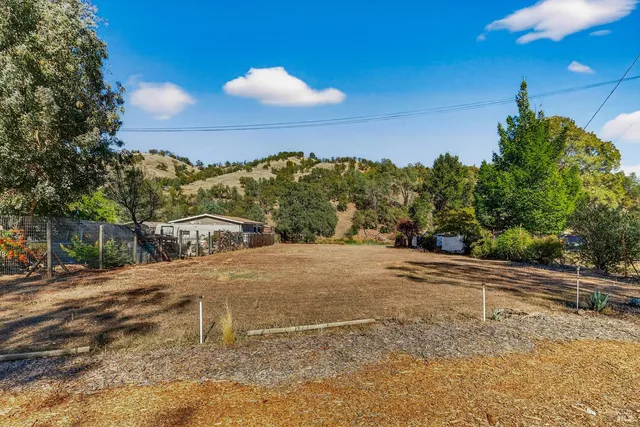 a view of a backyard of a house