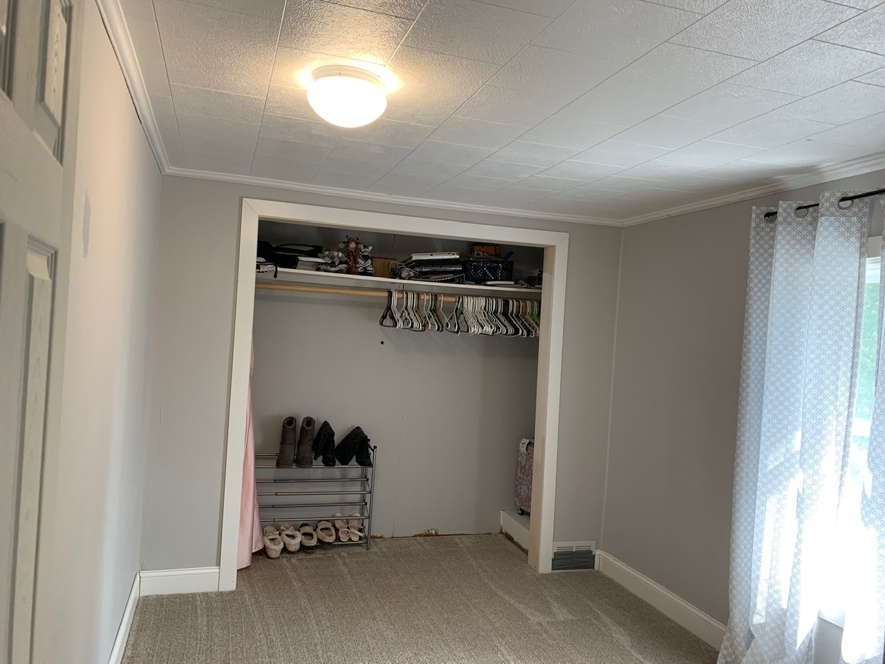 13920 Crosby Road Morrison, IL 61270 - Photo 19 of 30 a view of walk in closet with clothes and shoes