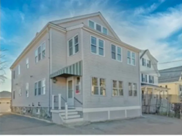 a front view of a building with a outdoor space