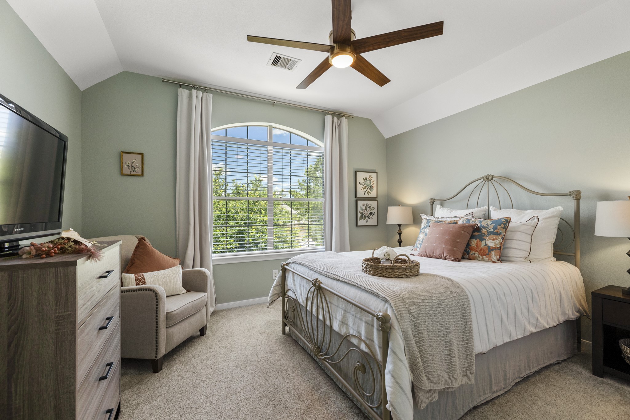 26 Winhall Place The Woodlands, TX 77354 - Photo 30 of 49 a bedroom with bed and a flat tv screen
