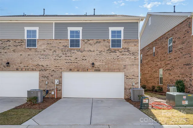 front view of a house with a bench