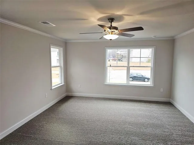 a view of an empty room with a window
