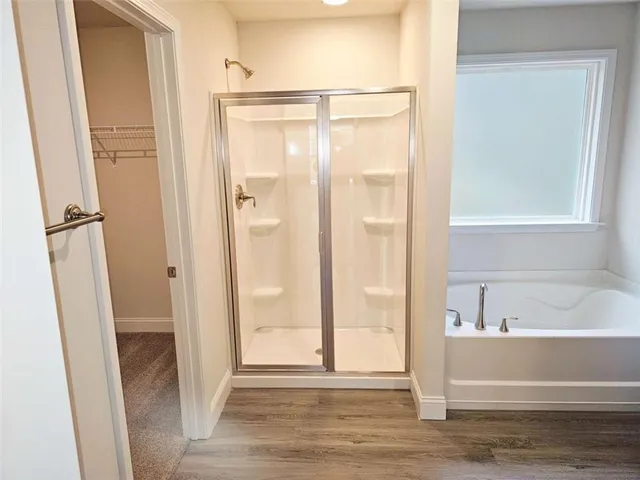 a bathroom with a glass shower door