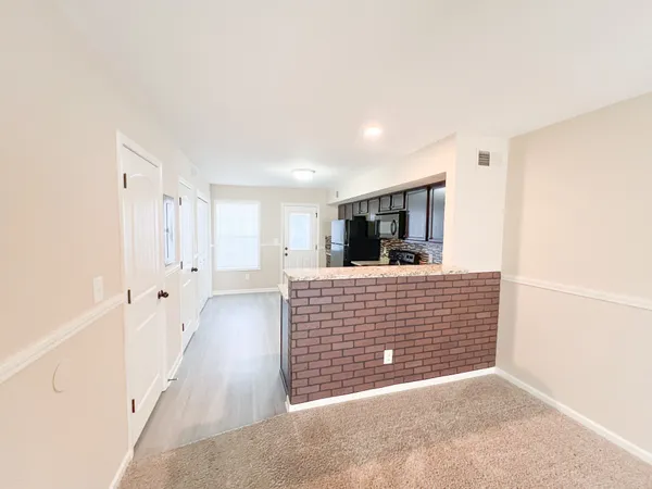 a view of livingroom with wooden floor