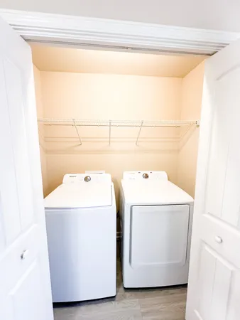 a utility room with dryer and washer