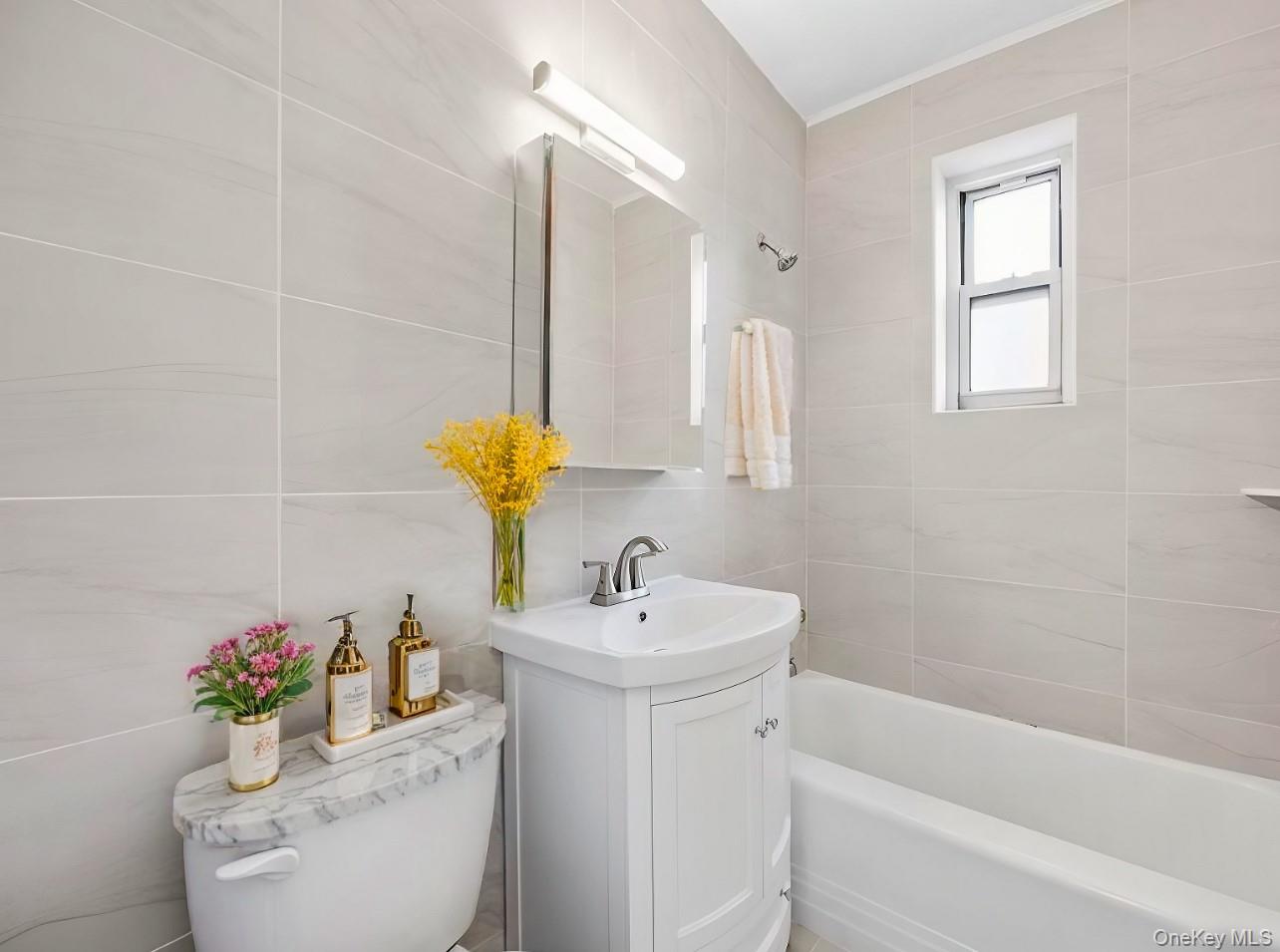 230 Pelham Road, Unit 1O New Rochelle, NY 10805 - Photo 8 of 29 a bathroom with a sink and a mirror