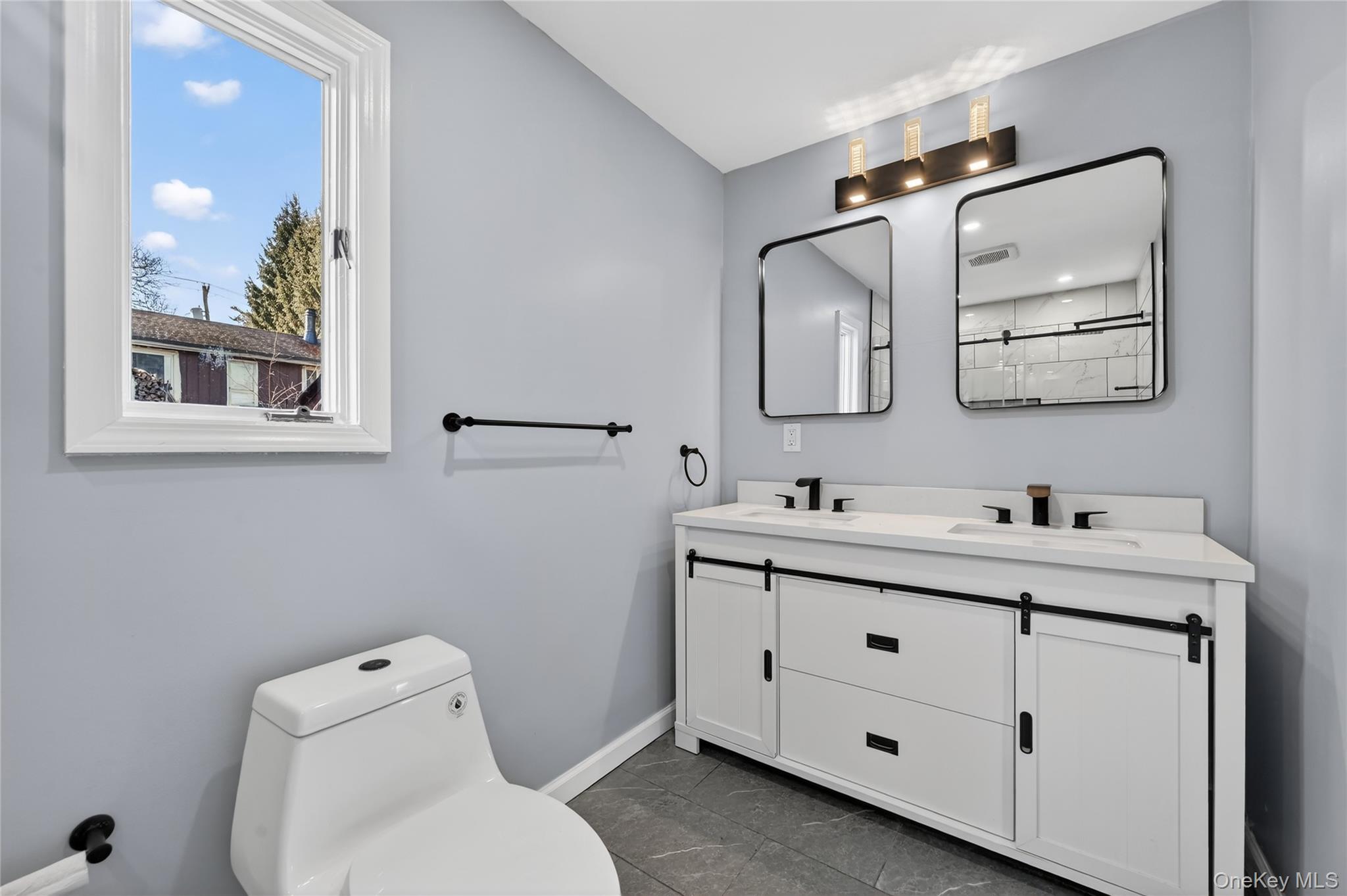 2 The Curve Road Rock Hill, NY 12775 - Photo 19 of 31 a bathroom with a toilet sink and mirror