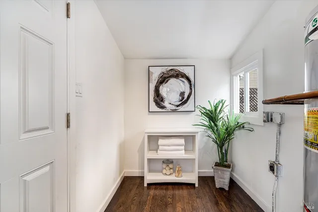 a bathroom with a sink mirror and shower