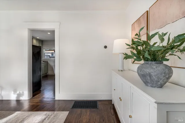 a living room with furniture a fireplace and a window