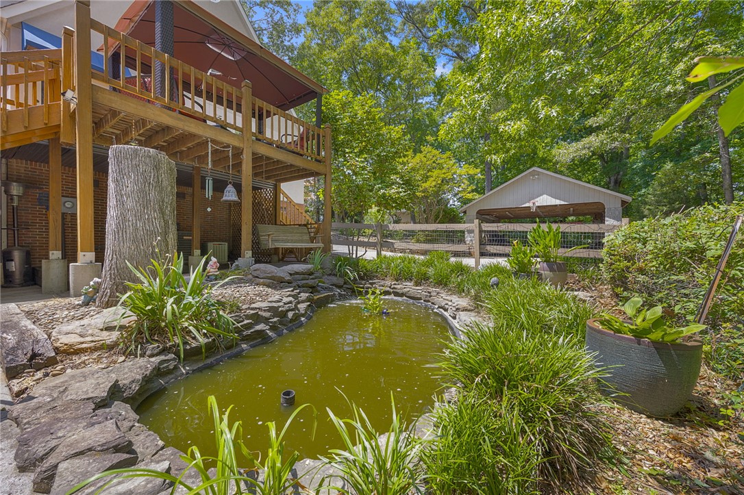 218 Northridge Drive Anderson, SC 29621 - Photo 39 of 50 A tranquil pond and lush landscaping complement the multi-level deck of this outdoor retreat.
