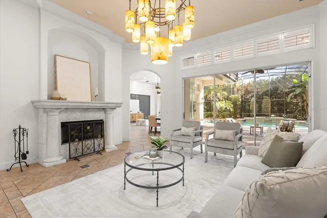 a view of a dining room with furniture and chandelier