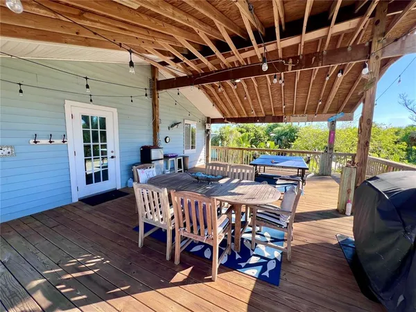 a view of a balcony with wooden floor