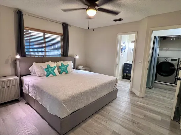 a view of swimming pool with wooden floor and garden