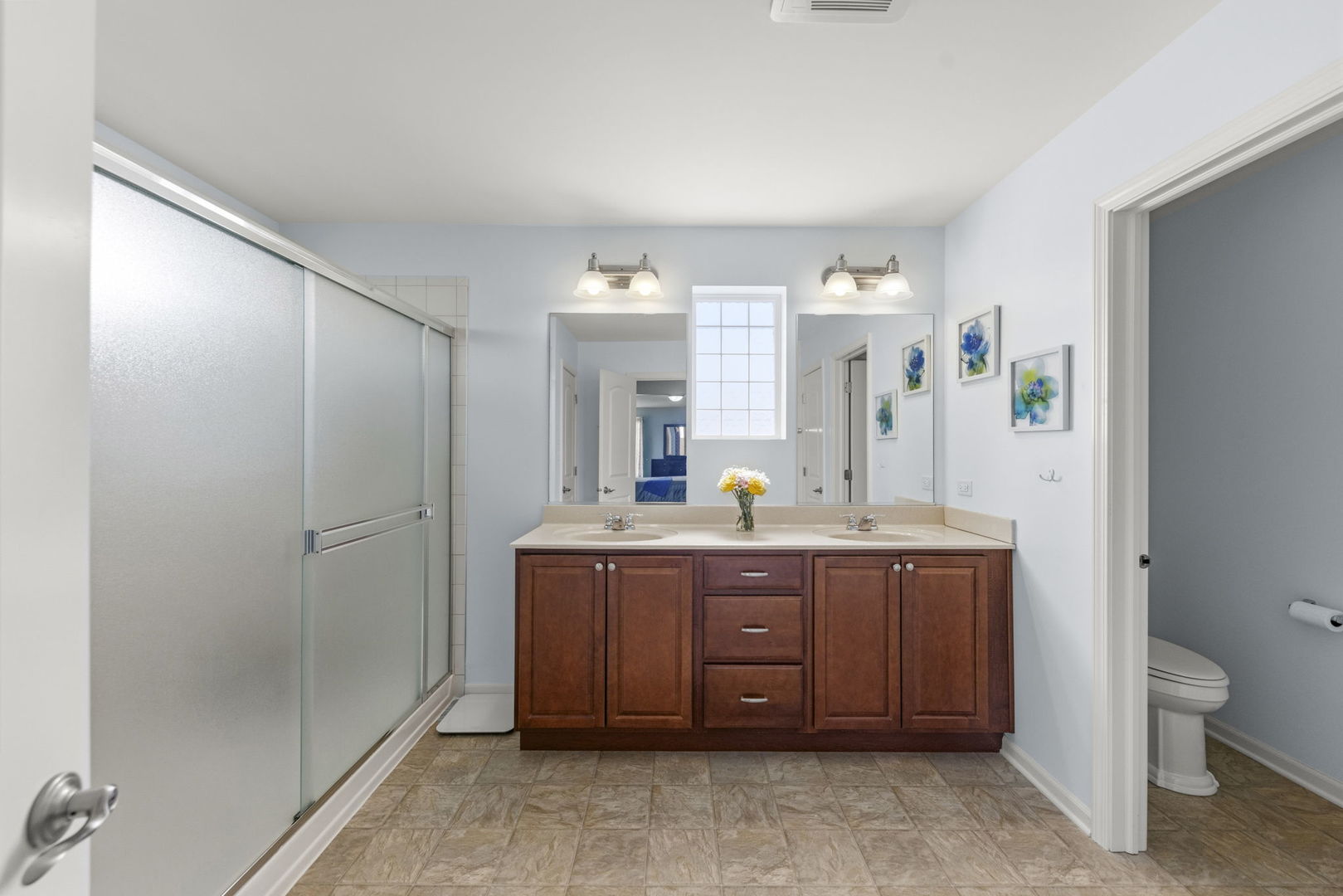 3306 Rumsford Boulevard Elgin, IL 60124 - Photo 17 of 29 a spacious bathroom with a granite countertop sink a toilet and a mirror