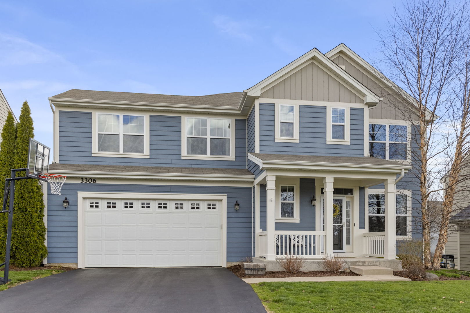 3306 Rumsford Boulevard Elgin, IL 60124 - Photo 2 of 29 a front view of a house with a yard