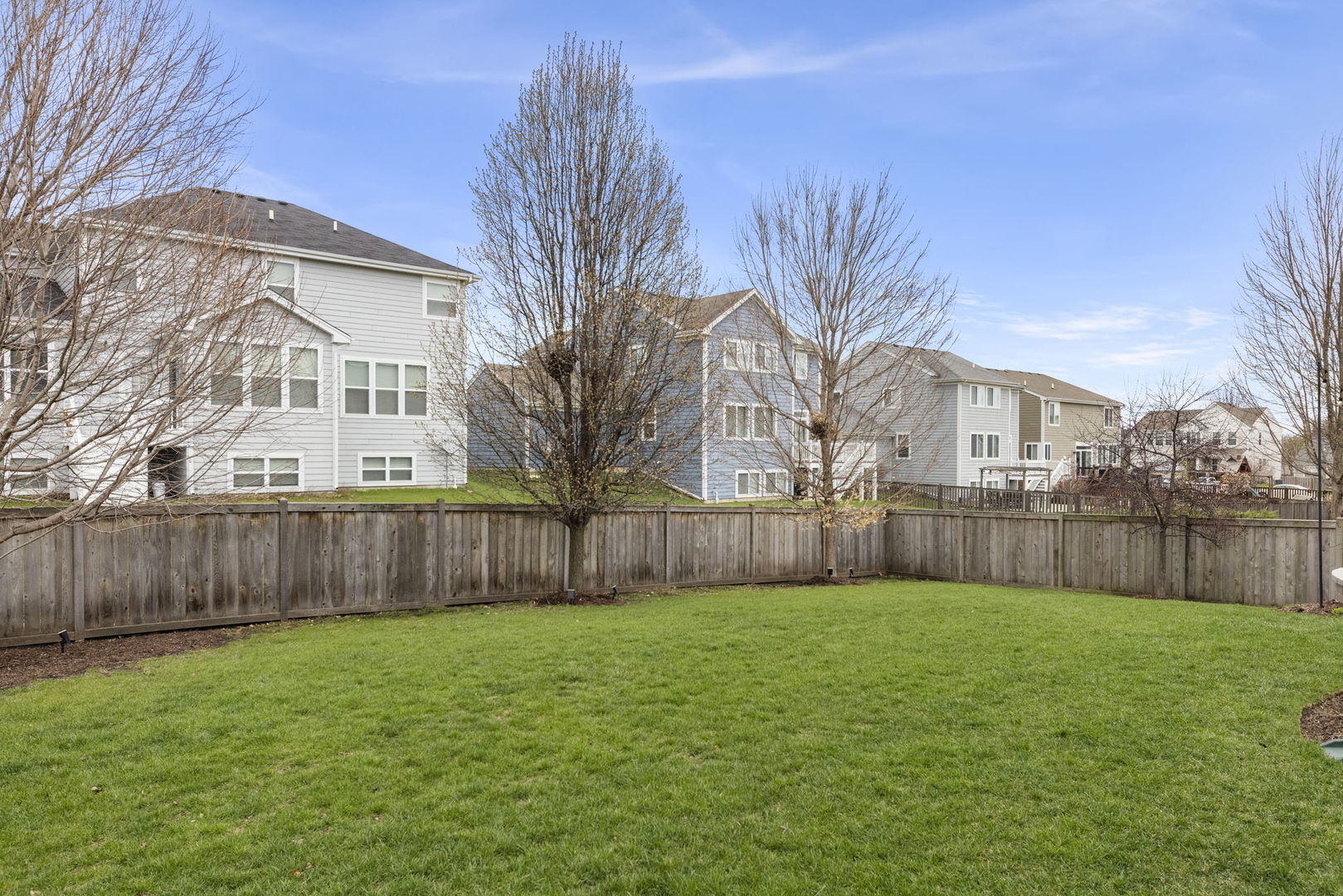 3306 Rumsford Boulevard Elgin, IL 60124 - Photo 27 of 29 a view of backyard with a garden and large trees