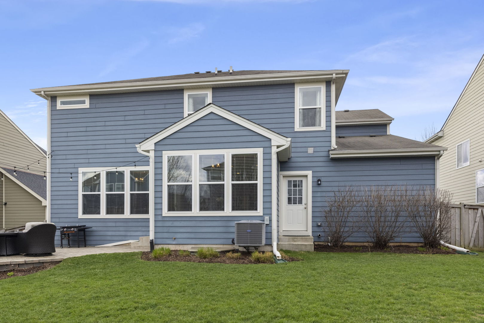 3306 Rumsford Boulevard Elgin, IL 60124 - Photo 29 of 29 a front view of a house with a yard