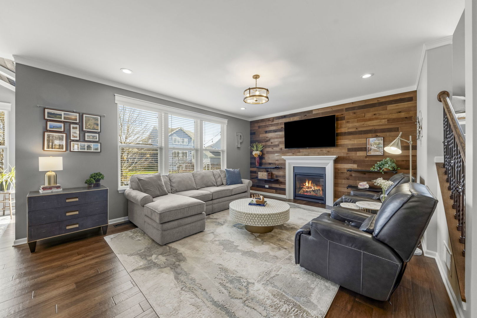 3306 Rumsford Boulevard Elgin, IL 60124 - Photo 5 of 29 a living room with furniture a fireplace and a flat screen tv