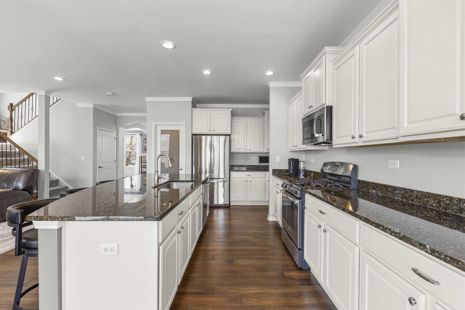 3306 Rumsford Boulevard Elgin, IL 60124 - Photo 9 of 29 a kitchen with stainless steel appliances granite countertop a sink a stove and a refrigerator