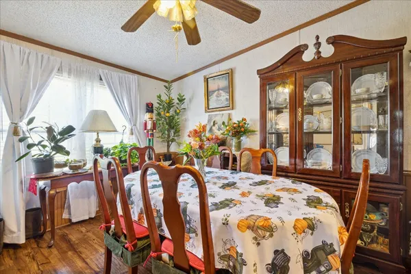 a bedroom with furniture and a large window