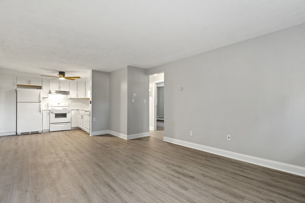 1105 Lexington Street, Unit 102 Waltham, MA 02452 - Photo 13 of 41 a view of a kitchen with wooden floor