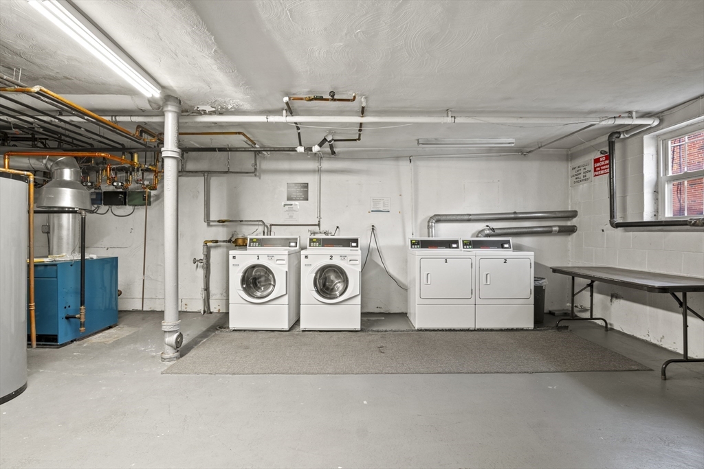 1105 Lexington Street, Unit 102 Waltham, MA 02452 - Photo 32 of 41 a utility room with washer and dryer
