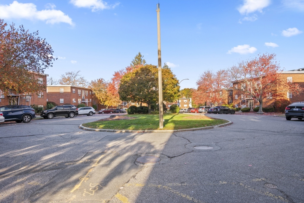 1105 Lexington Street, Unit 102 Waltham, MA 02452 - Photo 39 of 41 a view of a street with houses