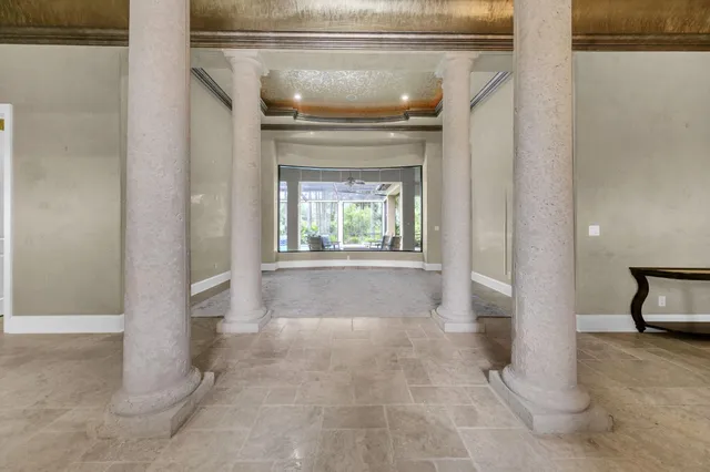 a view of a livingroom with wooden floor and furniture