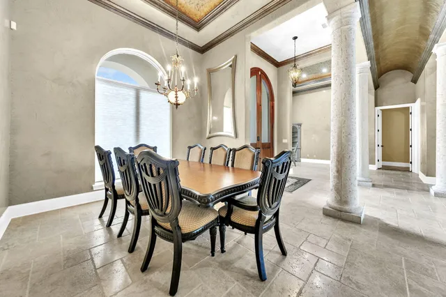 a large kitchen with kitchen island a stove a sink and a dining table