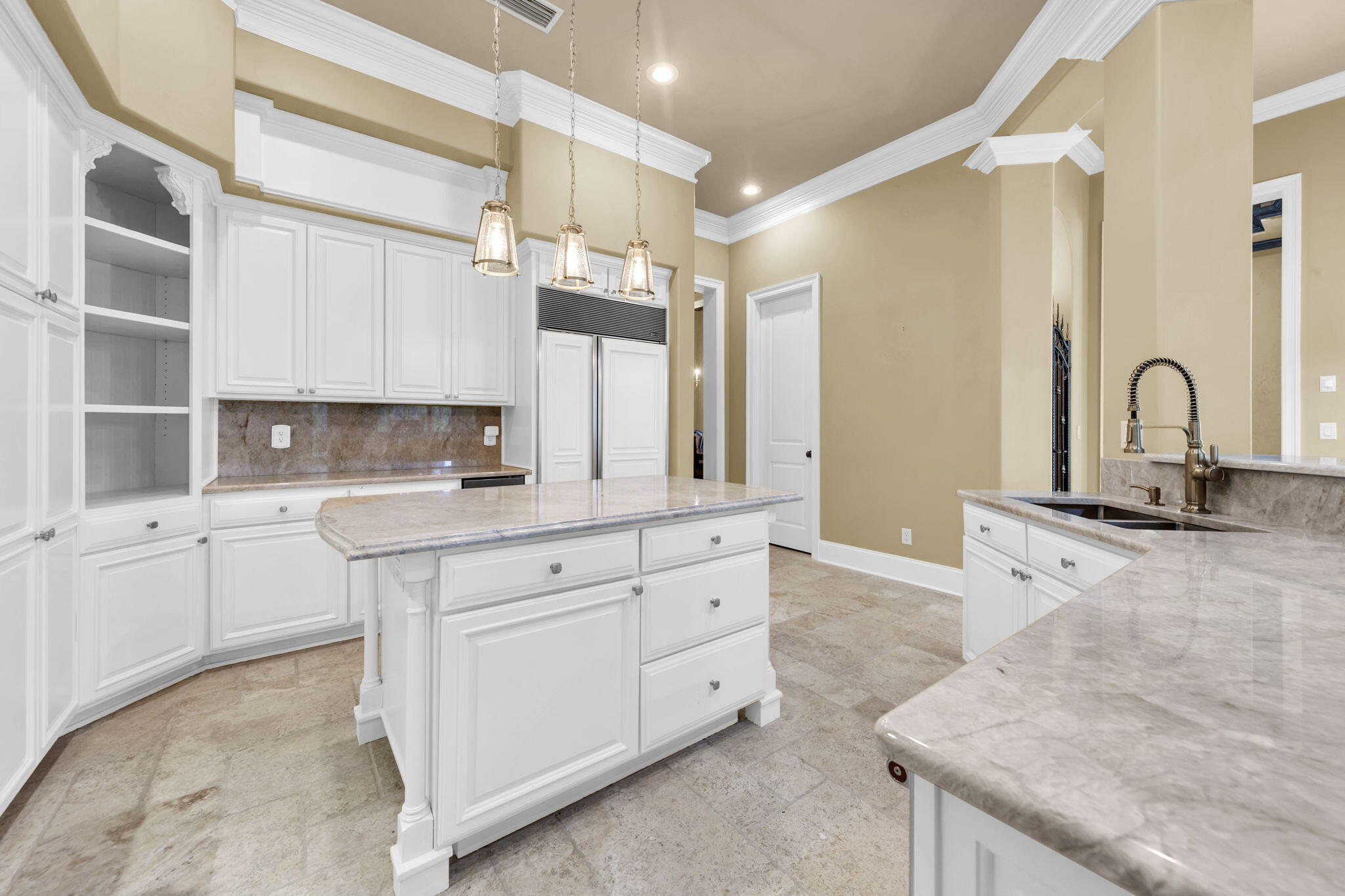 428 Captains Circle Destin, FL 32541 - Photo 21 of 68 a kitchen with granite countertop a sink stainless steel appliances and cabinets