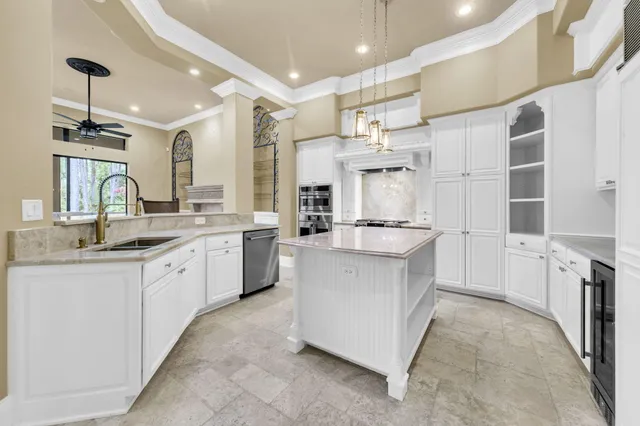 a living room with furniture ceiling fan and a fireplace