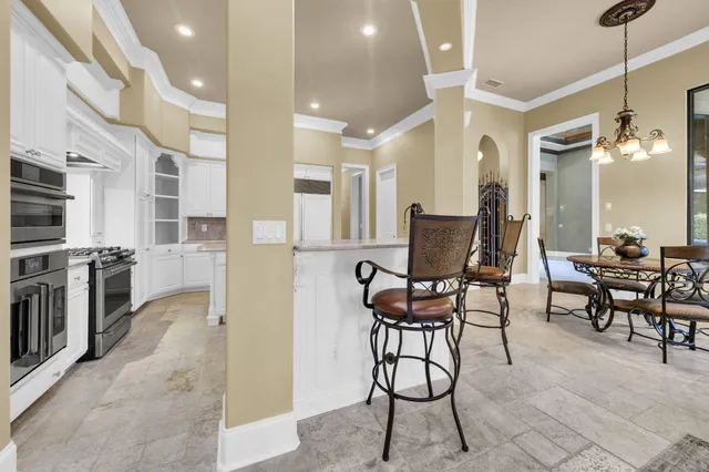 a lobby with furniture and floor to ceiling window
