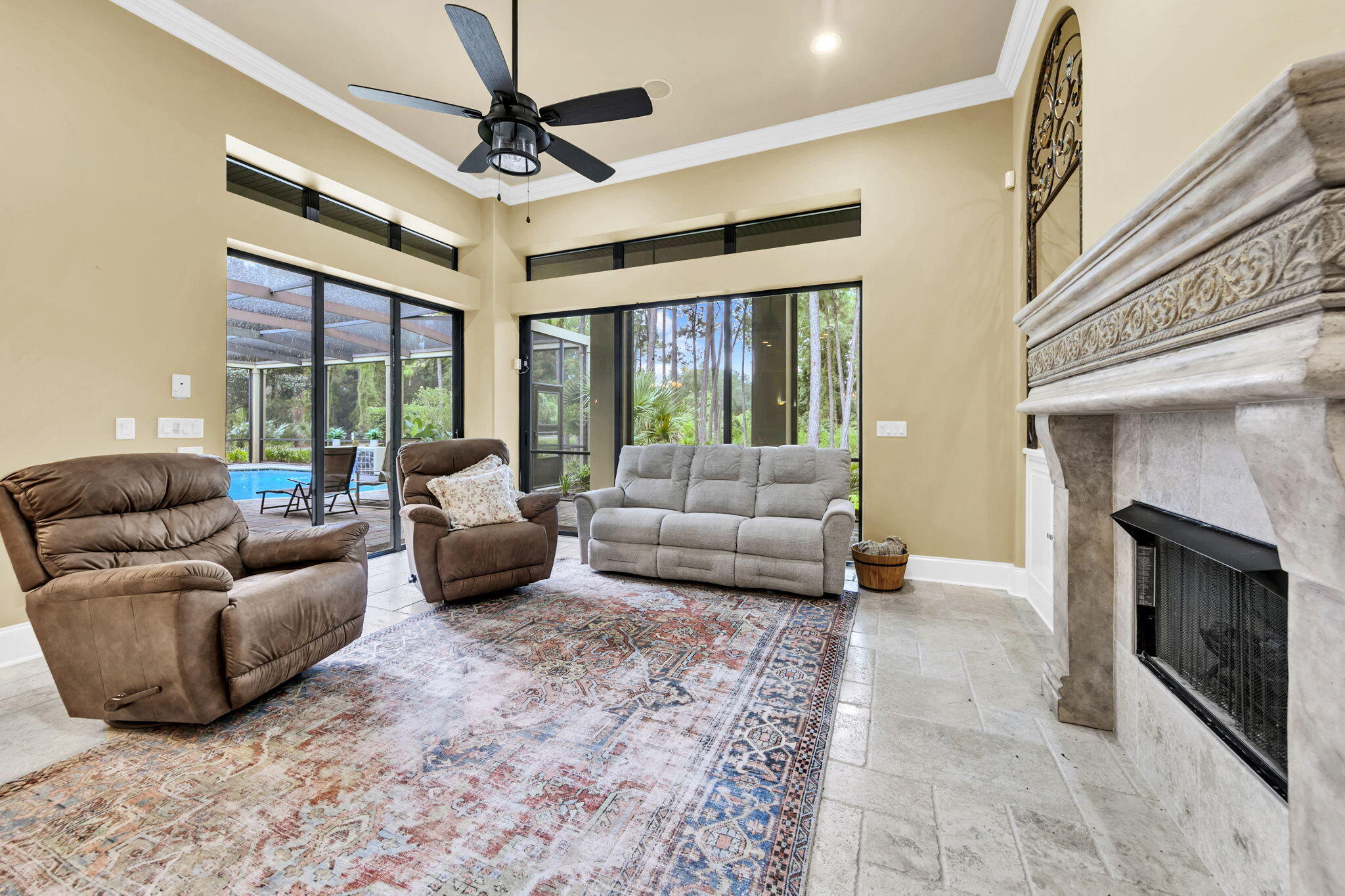 428 Captains Circle Destin, FL 32541 - Photo 30 of 68 a living room with furniture ceiling fan and a fireplace