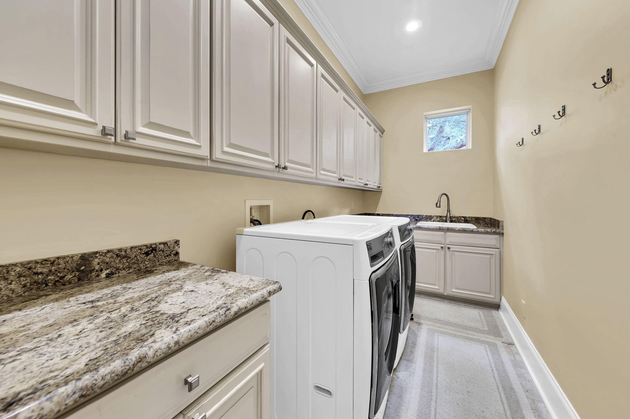 428 Captains Circle Destin, FL 32541 - Photo 54 of 68 a utility room with sink dryer and washer
