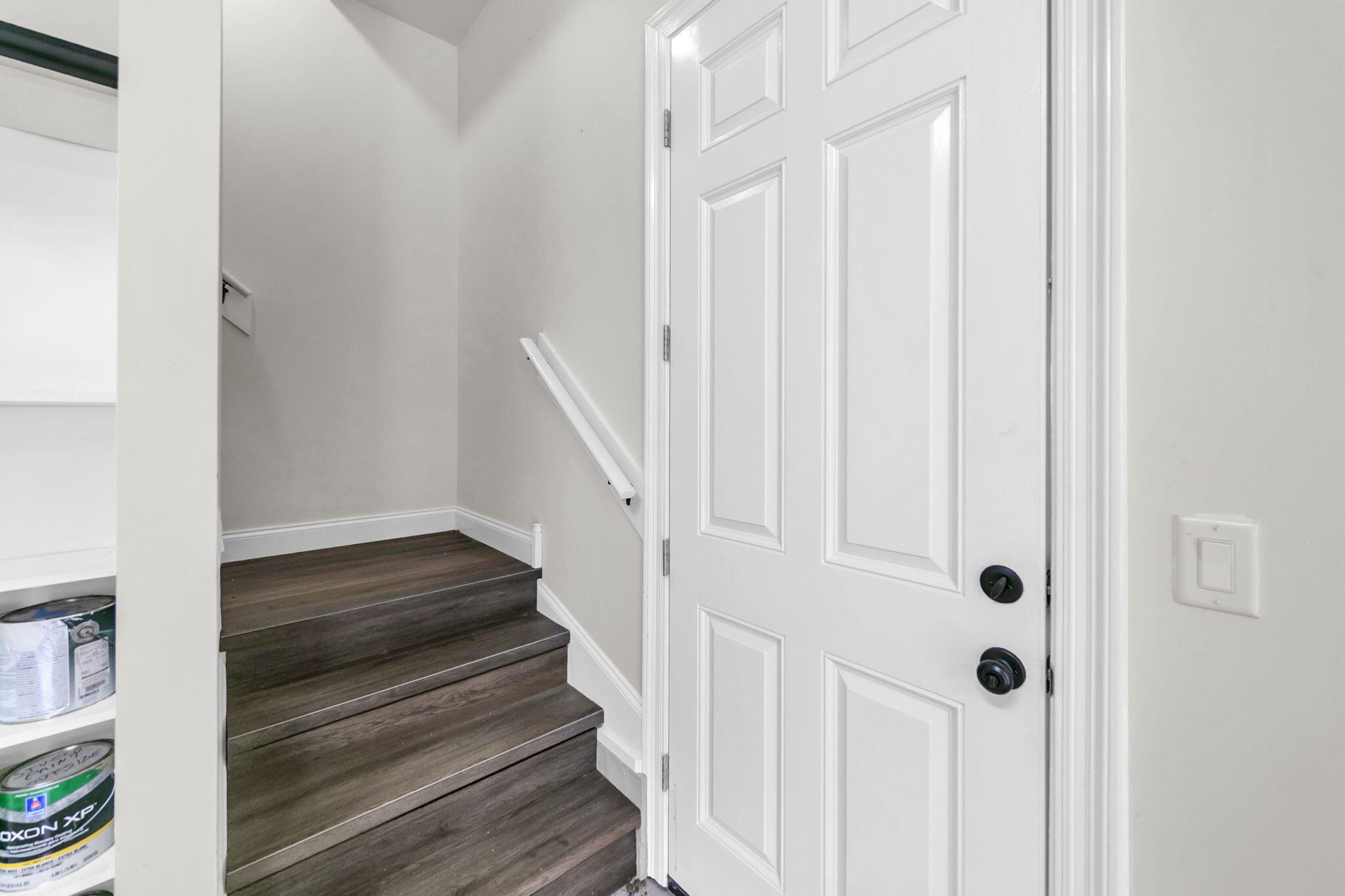 428 Captains Circle Destin, FL 32541 - Photo 56 of 68 a view of a hallway with wooden floor and staircase