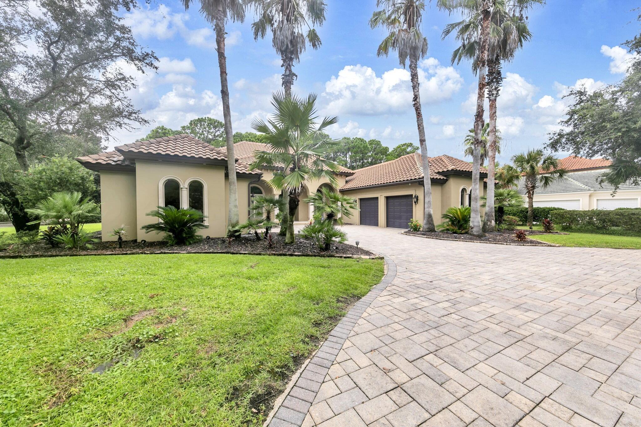 428 Captains Circle Destin, FL 32541 - Photo 6 of 68 a front view of a house with garden
