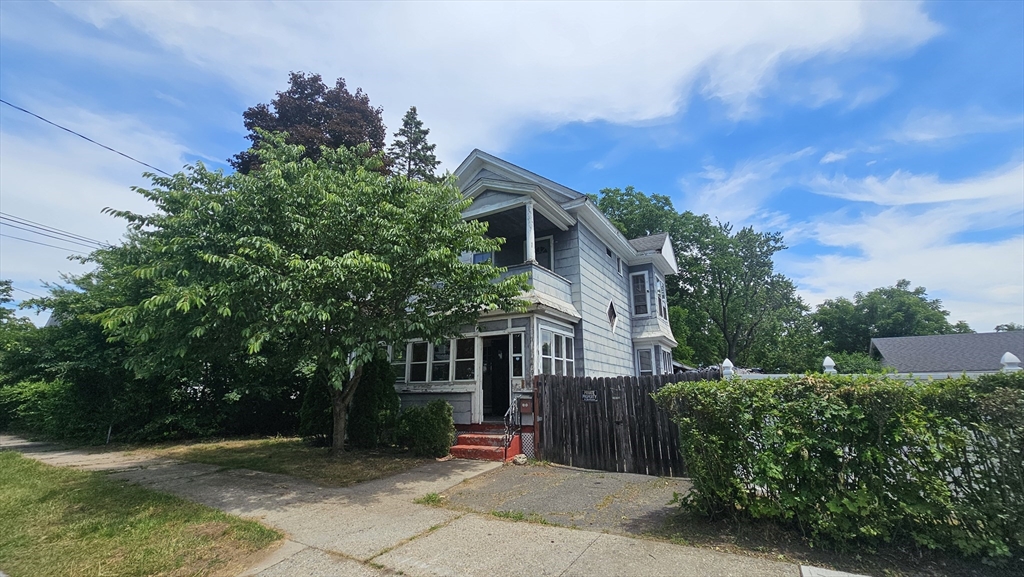 179 Oak Street Springfield, MA 01151 - Photo 1 of 28 a view of brick house with a yard