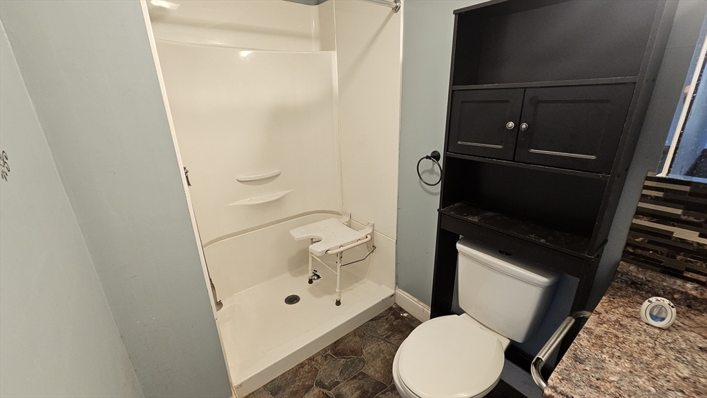 179 Oak Street Springfield, MA 01151 - Photo 11 of 28 a bathroom with a toilet and a shower