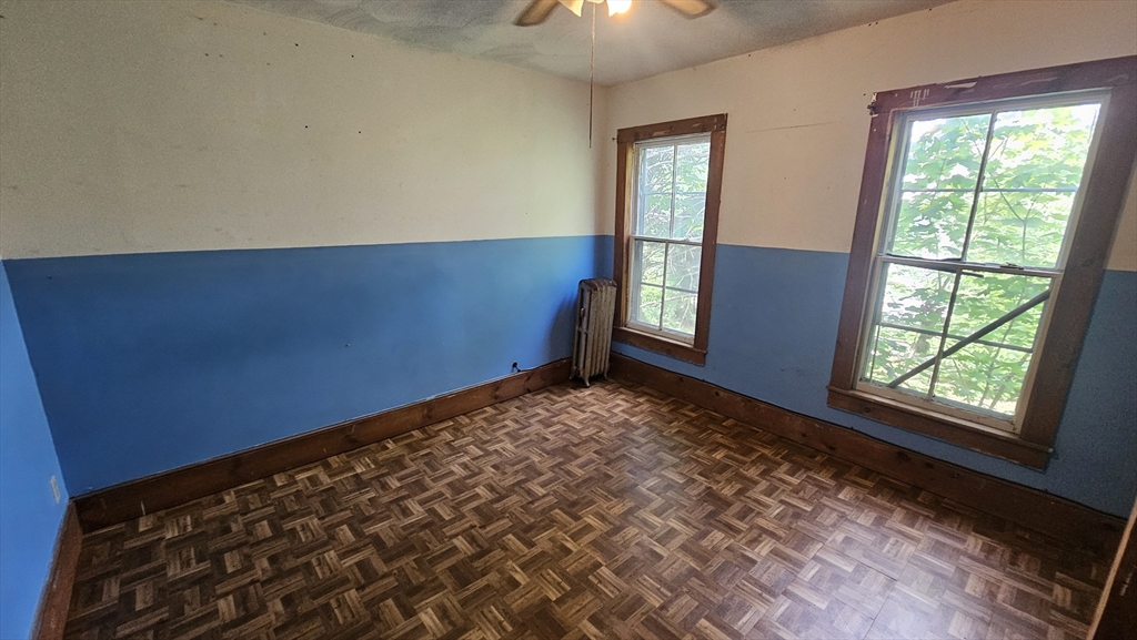 179 Oak Street Springfield, MA 01151 - Photo 18 of 28 a view of an empty room and window